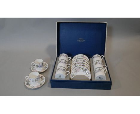 A Royal Worcester June Garland, six person coffee set, boxed with two spare cups and saucers (one Blue Poppy, one June Garlan