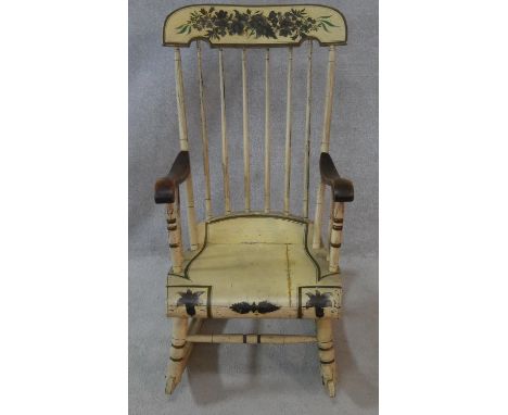 A late 19th century stick back rocking chair with its original all over floral painted decoration. H.102cm 