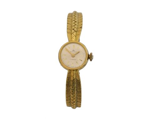 An 18ct gold ladies Bucherer manual wind wristwatch. The signed circular dial with baton markers, cal, 2412 ETA 17 jewel manu