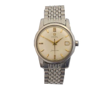 A 1950s stainless steel Omega Seamaster automatic wristwatch, ref. 2849-1SC. The signed circular dial with gold tone baton ma