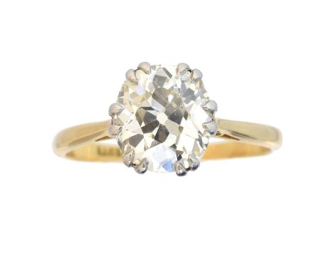 A diamond single stone ring. The old cut diamond weighing approx. 2.05cts within a six claw setting, estimated colour K-L, es