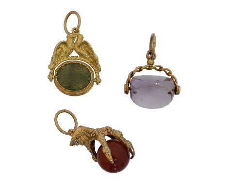 Three gem-set fobs. To include a 9ct gold claw fob, a banded agate and aventurine quartz dove spinner fob stamped 375, and an