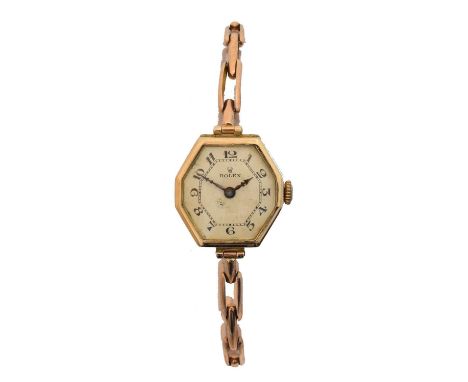 A 1920s 9ct gold ladies Rolex manual wind wristwatch. The signed hexagonal dial with Arabic markers and inner chapter ring, s