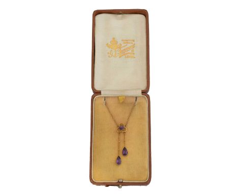 An early 20th century amethyst negligee necklace. The pear shape amethyst duo suspended from a circular shape sapphire surmou