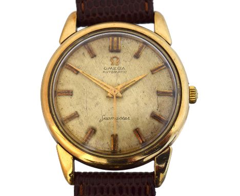 A 1960s 9ct gold Omega Seamaster automatic wristwatch, ref. 147361. The signed textured gold tone dial with baton markers and