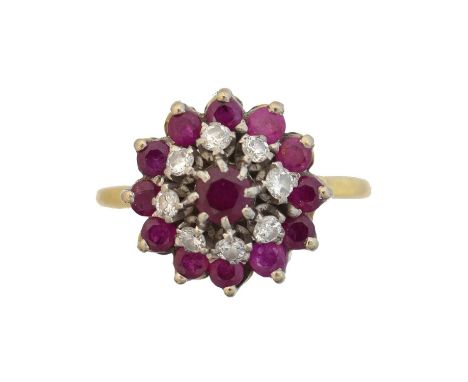 A ruby and diamond cluster ring. The circular shape ruby and single cut diamond tiered cluster with polished shoulders, stamp