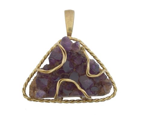A 1970s 9ct gold amethyst pendant. The triangular shape amethyst geode within a caged setting and rope twist surround, sponso