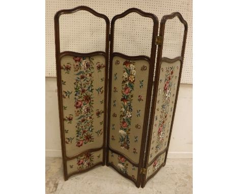 A walnut framed three fold screen in the Louis XV manner with glazed upper panels and needlework tapestry lower panels, 126 c