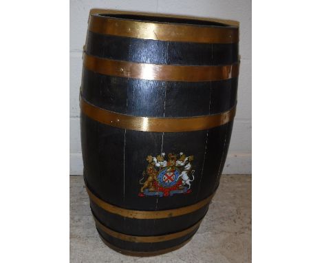 A modern coopered oak and brass bound stick stand of barrel form bearing transfer decorated Royal coat of arms 61 cm high x a