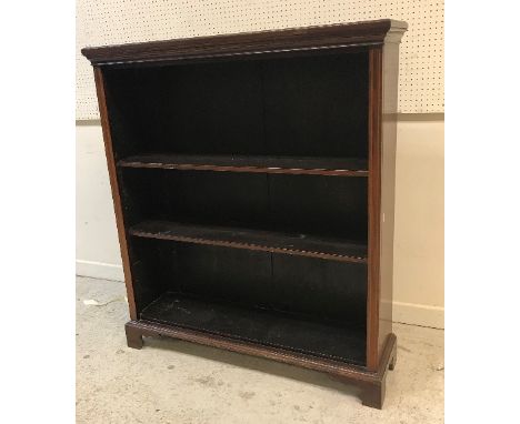 An Edwardian mahogany and satinwood strung open bookcase with adjustable shelving, raised on bracket feet, 106.5 cm wide x 31