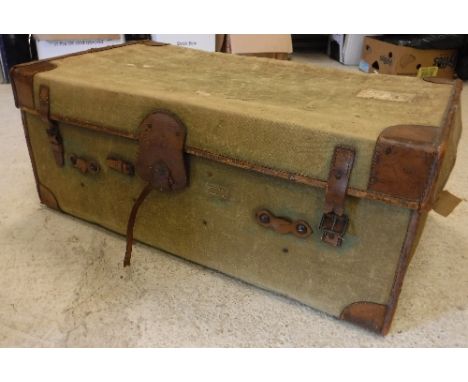 A circa 1900 leather bound green canvas covered travel trunk with tray to interior 107 cm wide x 44 cm high x 60 cm deep