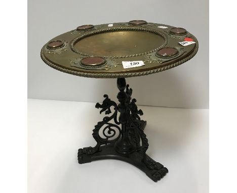 A 19th Century Continental bronze, brass and rosso marble medallion decorated tazza on a stand with stylised dragon supports,