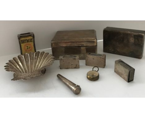 A collection of silver wares to include a stylised scallop shell butter dish, silver mounted cigarette box inscribed "Hurwort