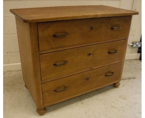 A 19th Century Continental pine commode of three long drawers, raised on turned feet, 100 cm wide x 54 cm deep x 81 cm high