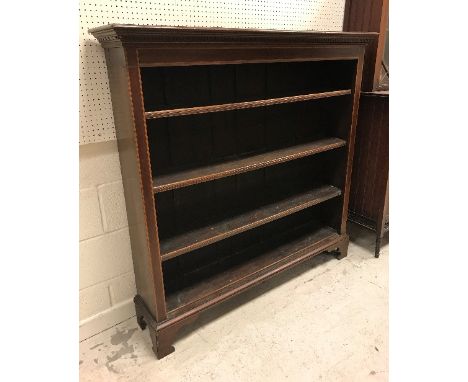 An Edwardian mahogany and satinwood banded open bookcase with three adjustable shelves, raised on bracket feet, 132 cm wide x