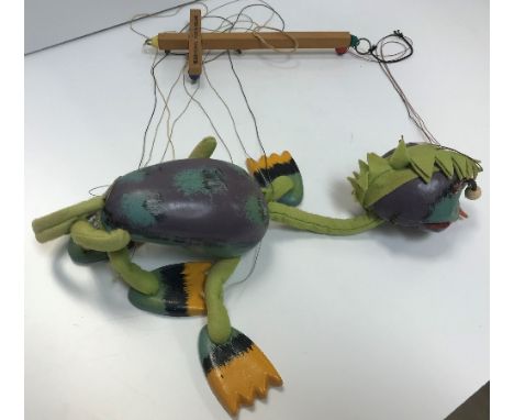 A Pelham Puppet sea monster puppet together with three Wupper Airlines puppets, one in box