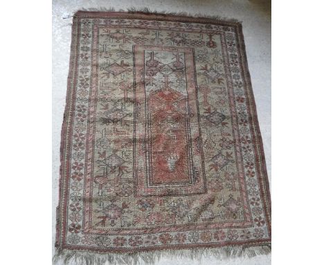 An Ushak prayer rug, the centre field with geometric medallion decoration within a lozenge medallion and arrow field and flow