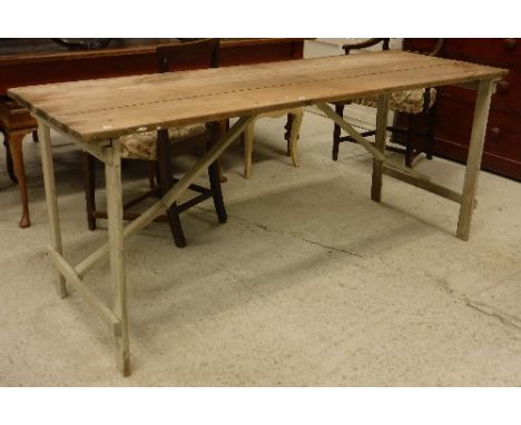 A 20th Century pine and painted folding trestle table 182 cm x 64.4 cm x 75.5 cm high together with an aluminium folding ladd