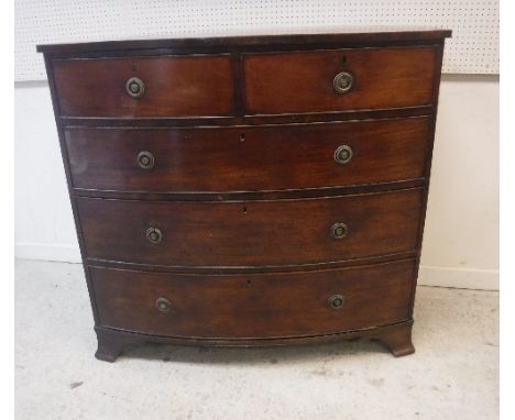 A Victorian mahogany bow fronted chest, the top satinwood strung over two short and three long graduated drawers to splayed b