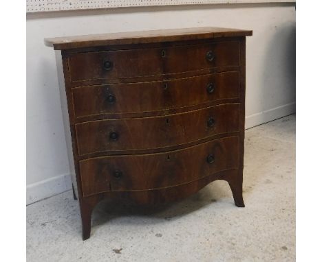 A mahogany and satinwood strung serpentine fronted chest in the George III taste, the plain top above four long graduated dra