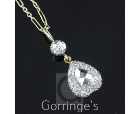 A Victorian style gold and diamond inverted heart shape pendant necklace, with central rose cut diamond weighing approximatel