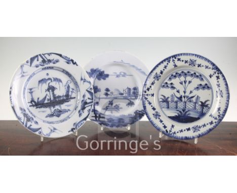 Three English delft ware plates, c.1760-70, the first painted with a European scene of boats on a lake, the second with a Chi
