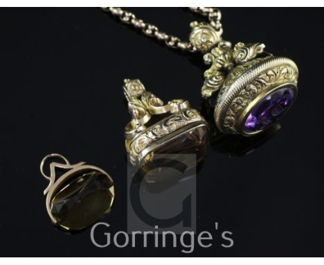 Three late 19th/early 20th century quartz set fob seals, 15ct gold citrine and 9ct gold citrine and an ornate gold overlaid a