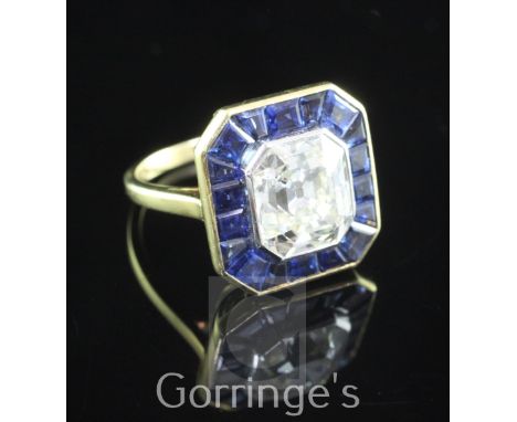 A mid 20th century gold, asscher cut diamond and sapphire set dress ring, the central diamond with the approximate dimensions