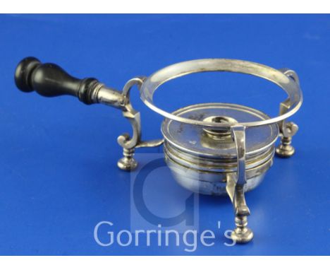 A Queen Anne silver tripod stand with burner, on scroll supports, with turned wooden handle, stamped with maker's mark only f