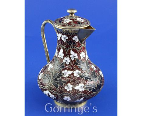 A mid 20th century Soviet Russian 88 zolotnik silver gilt and cloisonne enamel baluster jug and cover, with black and white e