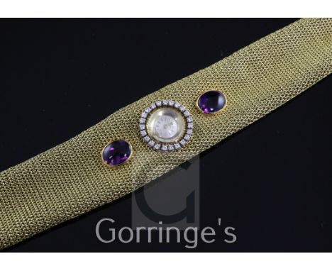 A lady's stylish 1960's 18ct gold, amethyst and diamond Zenith dress bracelet watch, the circular dial with baton numerals an