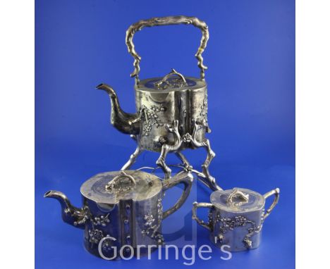 A late 19th/early 20th century Chinese export silver three piece tea set by Hung Chong & Co, Shanghai, of shaped circular for