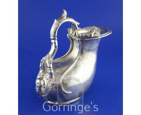 A Victorian textured silver Askos jug by John Samuel Hunt, with applied cast goat surmounts and pierced acanthus leaf capped 