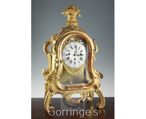 A mid 18th century German carved giltwood striking and chiming mantel clock, with enamelled Roman dial, silvered moonphase, c