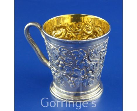 A Victorian silver christening mug by Hunt & Roskell, of tapering cylindrical form, with rustic handle, engraved monogram and