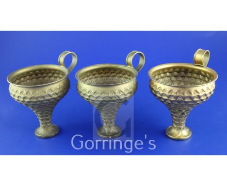 A set of three 1960's ancient Greek revival 900 standard silver gilt cups by Ilias Lalaounis, of tapering form, with repousse