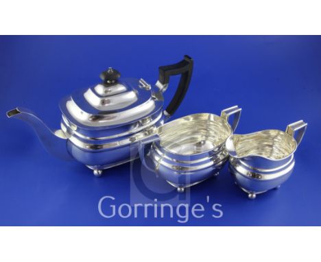 A George VI silver three piece tea set by William Hutton & Sons Ltd, of oval form, on ball feet, Sheffield, 1940, gross 34 oz