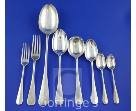 A George V part suite of silver Hanoverian rat-tail pattern flatware by Francis Stebbings, with engraved monogram, comprising