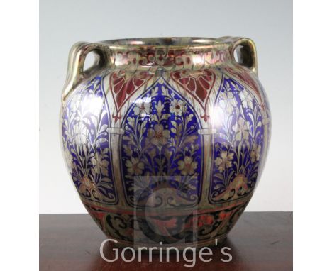 A large Pilkingtons Lancastrian lustre ovoid vase, c.1915, by Richard Joyce, decorated with silver and ruby lustre flowers to