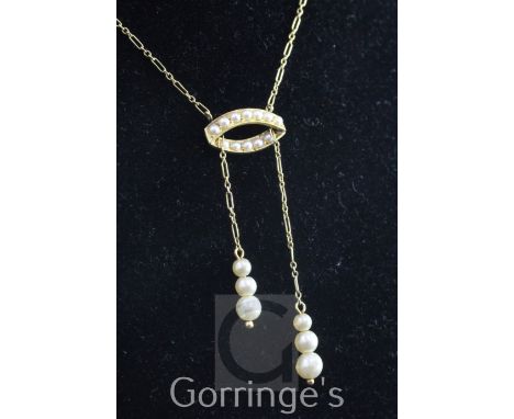 An Edwardian 15ct gold, simulated pearl and seed pearl drop pendant necklace, the fine link chain with elliptical seed pearl 