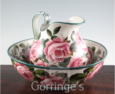 A Wemyss cabbage rose pattern wash basin and ewer, early 20th century, the ewer inscribed in green enamel Wemyss T.Goode & Co