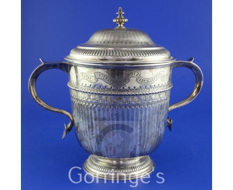 A George V demi-fluted silver two handled presentation cup and cover with inscription relating to the Royal International Hor