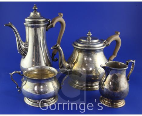 A 1960's/1970's four piece silver tea and coffee service, of baluster form, with wooden handles and turned finials, C.J. Vand