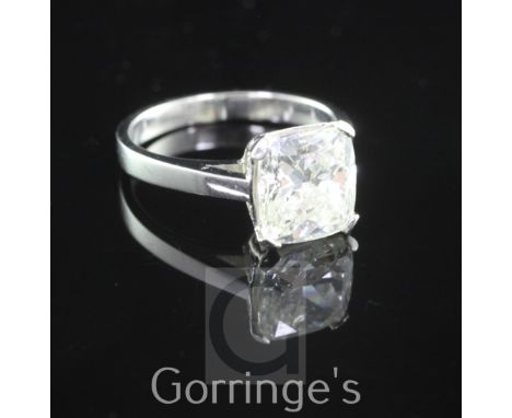 A platinum and solitaire diamond ring, with GIA certificate dated 10/12/2014, stating the 3.02 ct cushion modified brilliant 