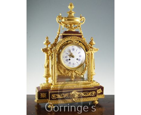 Le Merle Charpentier & Cie. A handsome late 19th century French ormolu and rouge marble mantel clock, of architectural form w