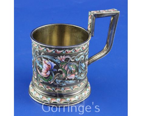 A late 19th/early 20th century Russian 84 zolotnik silver and cloisonne enamel tea glass holder, with angular handle and poly