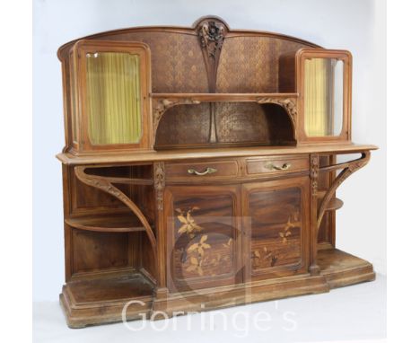 A Louis Majorelle 'Chicoree' pattern walnut and marquetry buffet, the raised back with two bevelled glazed doors and open she