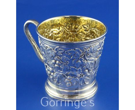 A Victorian silver christening mug by John Samuel Hunt, of tapering cylindrical form, with engraved monogram, rustic handle a