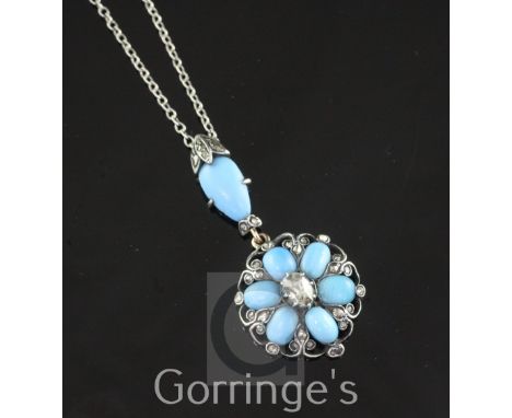 A late Victorian gold, silver, turquoise and diamond drop pendant, of flower head design and set with oval and pear shaped tu
