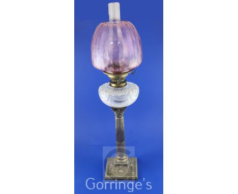 A late Victorian silver corinthian column Hinks's Duplex Patent oil lamp, with brass mounted cut glass reservoir and shaped p
